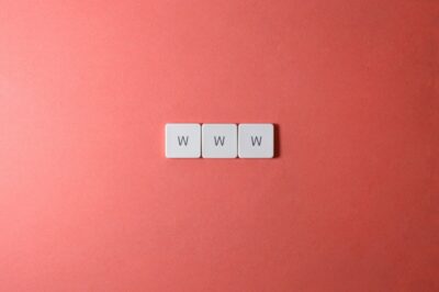 www - three w's on tiles on a light red background.
