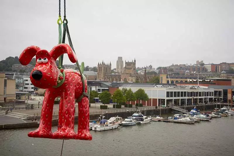 Strawberry Gromit winched high beside Bristol's river Avon.