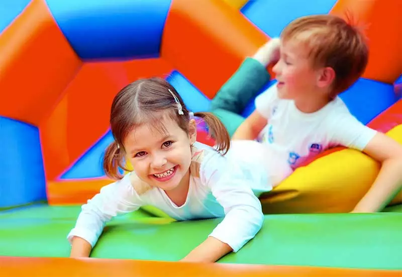 Children on a bouncy castle