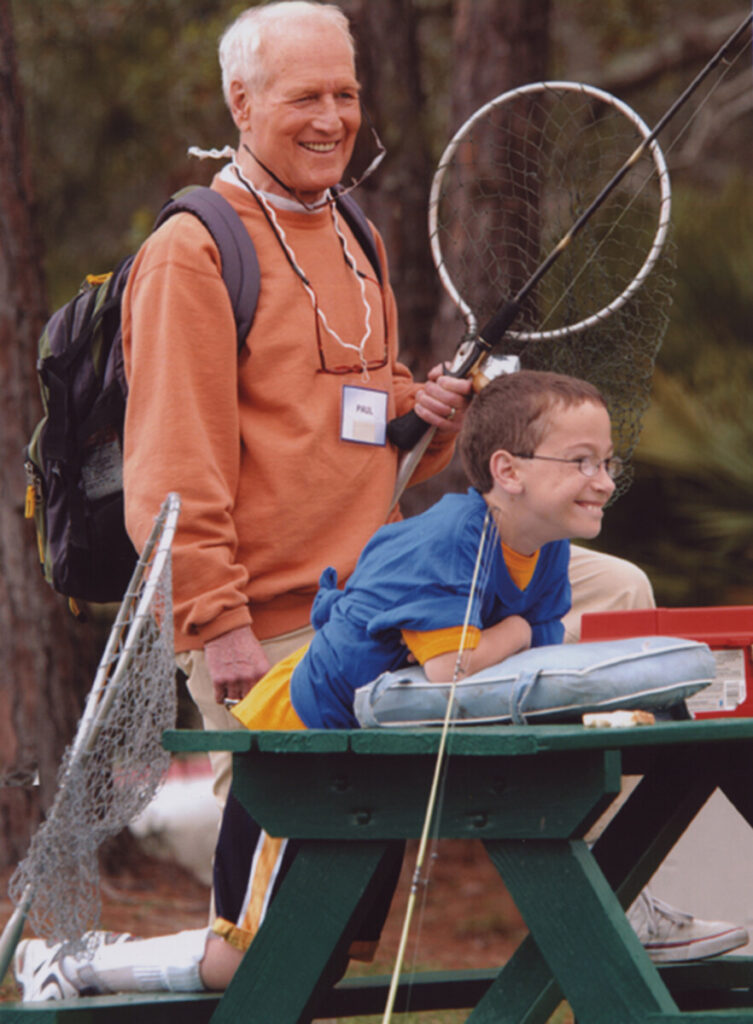 Paul Newman with children at the Over the Wall camp. Photo: Newman's Own Foundation