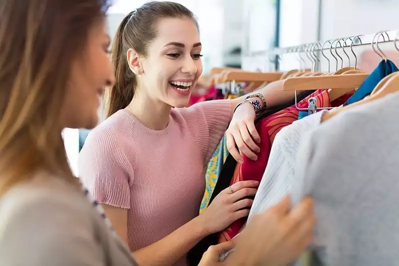 Two women in a clothes shop