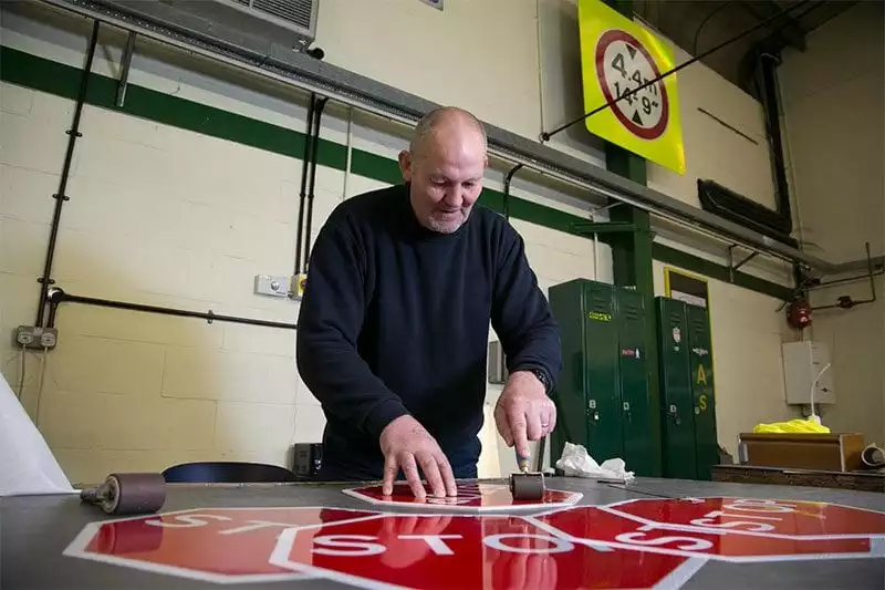 Sign maker at Britain's Bravest Manufacturing Company