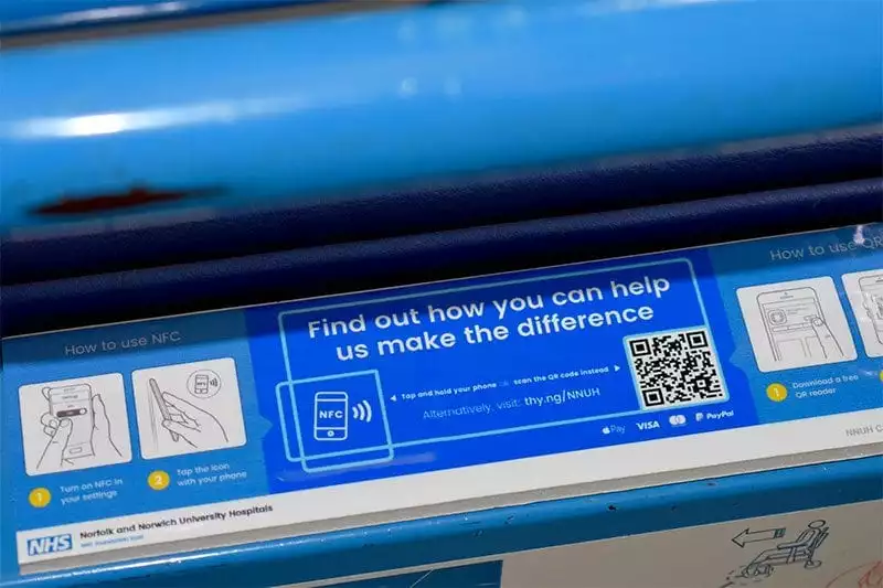 Portering chair with mobile donation sticker
