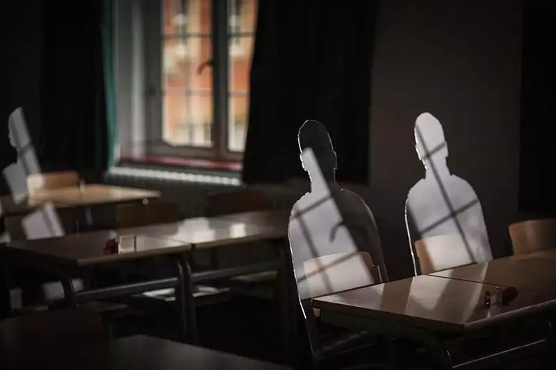 There But Not There silhouettes in a classroom