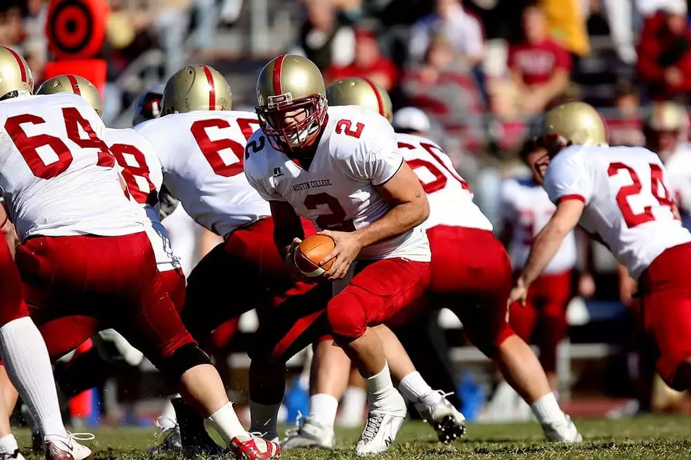 Quarterback in action on the field - Pixabay
