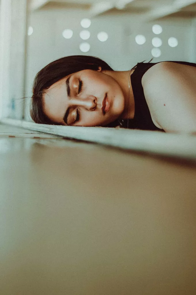 Bored woman, head down on a desk