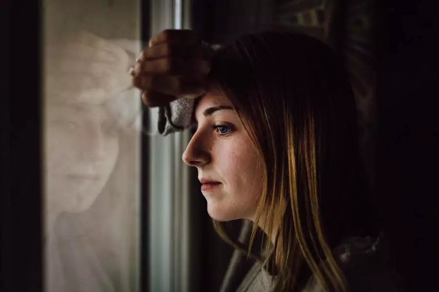 Woman looking out of a window