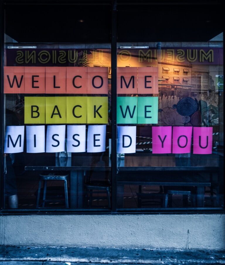 Welcome back. We missed you. Sign in a museum's window.