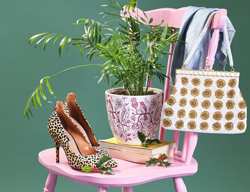 Hells and a handbag on a pink chair