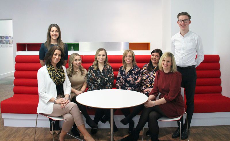 Team of people sitting around a table