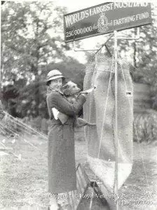 Woman and dog making a donation.