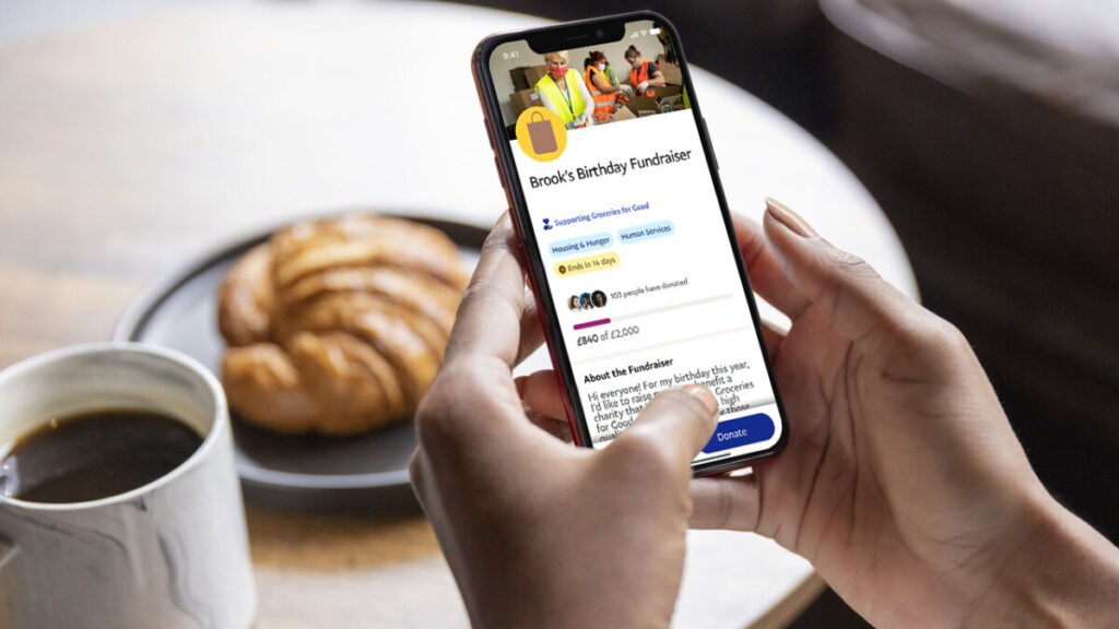 PayPal app at a coffee table showing a birthday fundraising campaign