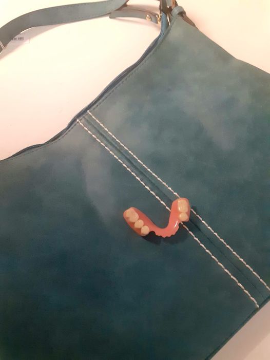 false teeth on a handbag