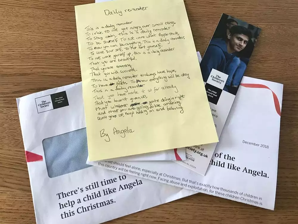 Direct mail pack from the Children's Society, laid out on a desk.