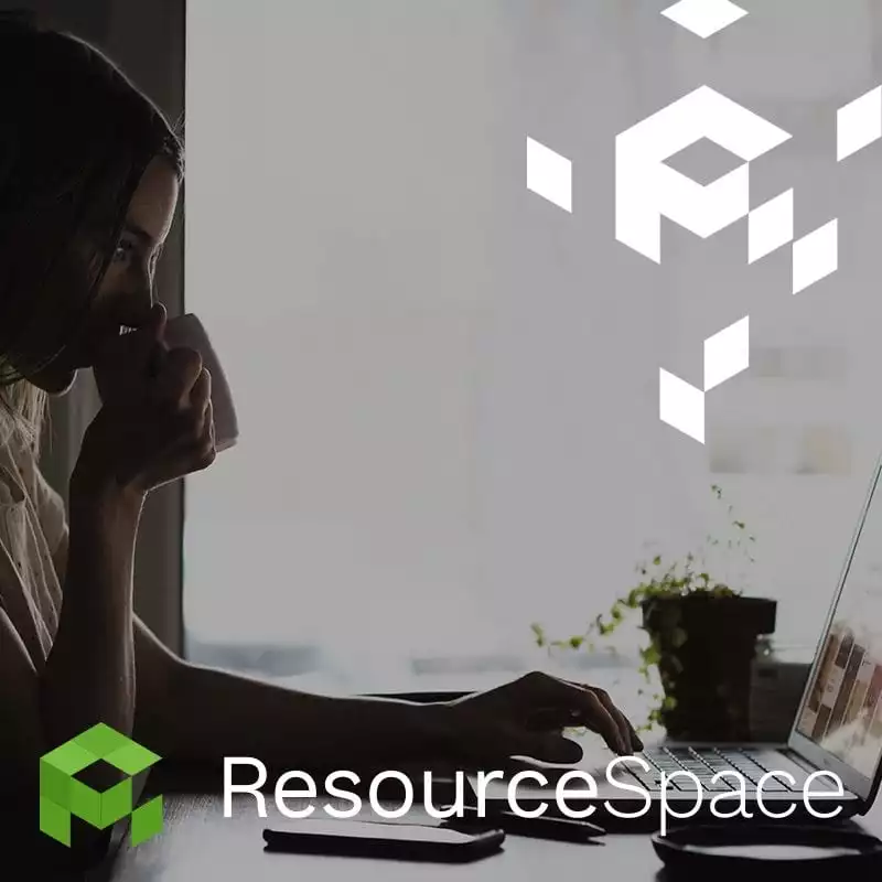 Remote access to digital assets - woman at a computer. Photo: ResourceSpace