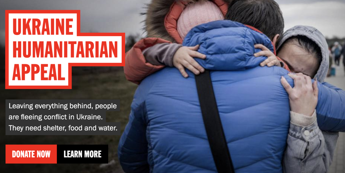 DEC Ukraine appeal. A man hugs his daughter and grandaughter after they crossed the border from Ukraine to Poland. Image: Michael Kappeler/dpa.