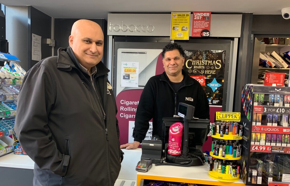 S&K Coventry's Nisa Local store owner Suk Kalm, with MADL collecting tin on the counter .