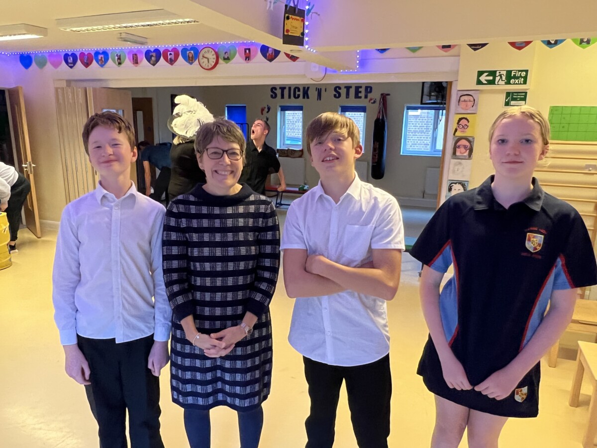 Sarah Johnson, new CEO at Stick 'n' Step with some children