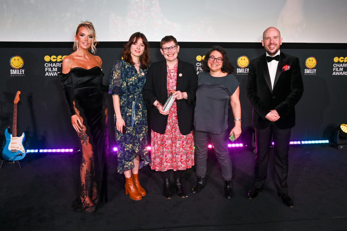 Faye Winter, Natasha Hawthornthwaite, Katy Styles, Lizzie Mistry from the We Care Campaign and Tom Allen on the stage at the Smiley Charity Film Awards at Odeon Luxe Leicester Square on March 21, 2023 in London, England. Credit: Dave Bennet / Getty
