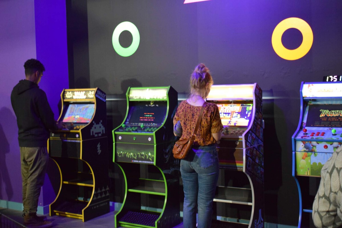 people play a game at Willen Hospice's new gaming shop, The Hangout