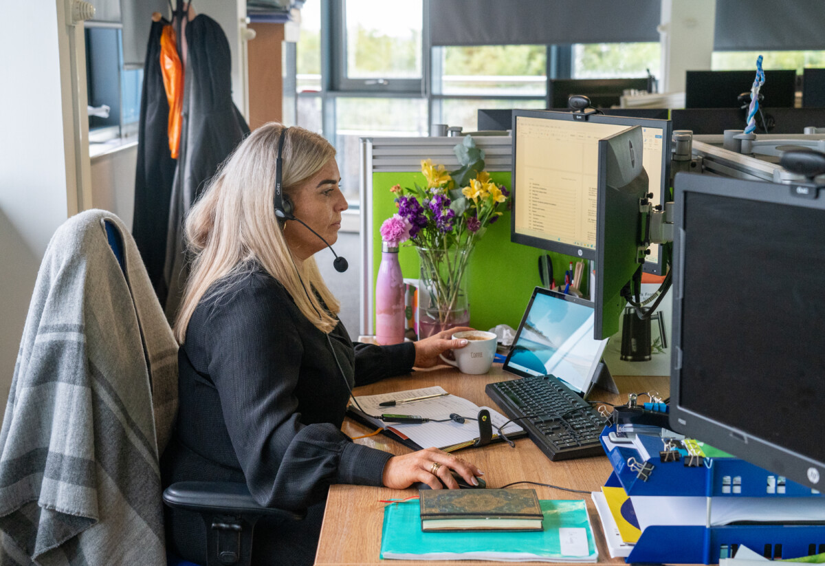 Stephanie Shanks working at a desk at Sight Scotland.