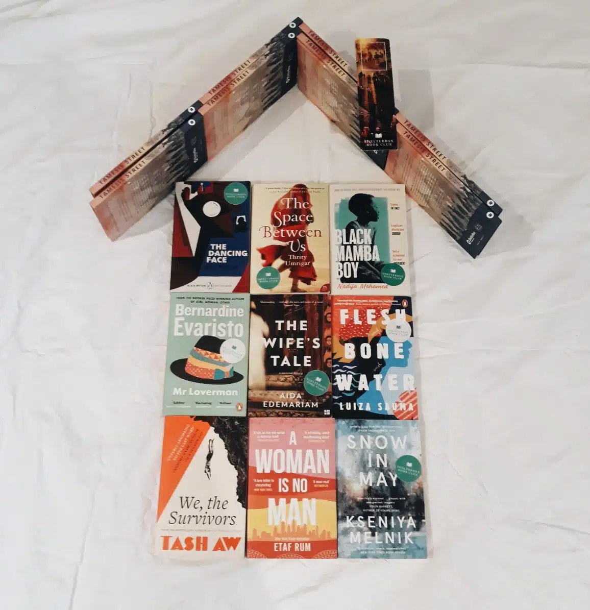 ShelterBox Book Club books in the shape of a house