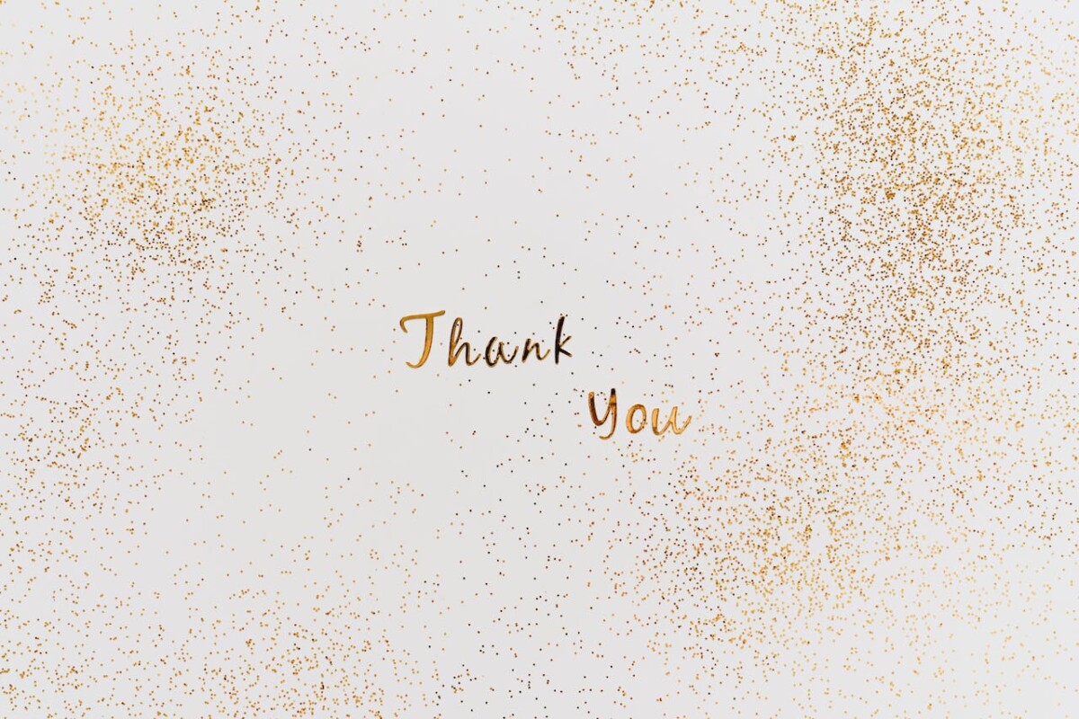 Thank you message in gold lettering with gold glitter. Photo: Alleksana on Pexels.com