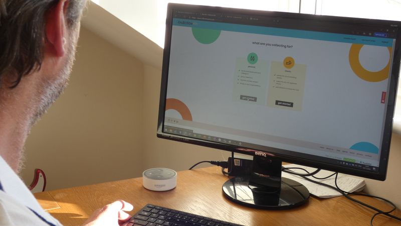 Man at desk looks at website asking "what will you collect?"