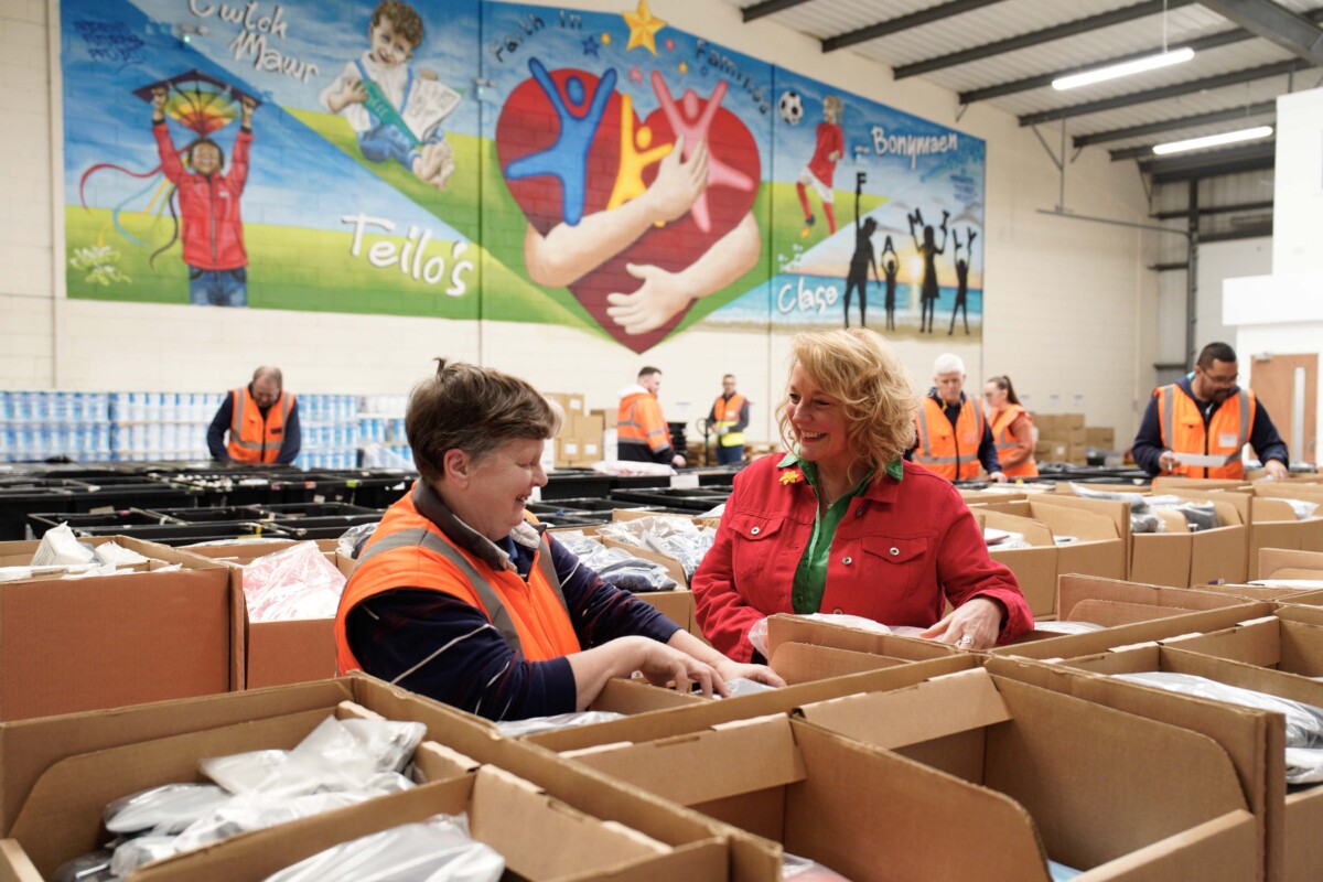 Cherrie Bija, CEO of Faith in Families with workers. Photo credit: Alistair Heap/PA Wire