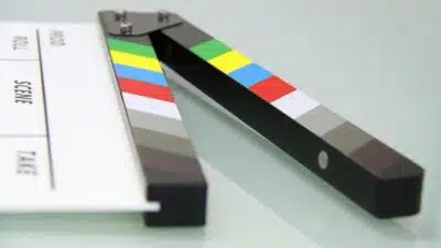 A film clapperboard with colour bars.