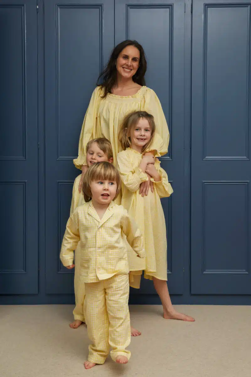 Mother and three children in yellow gingham nightwear from If Only If Nightwear.