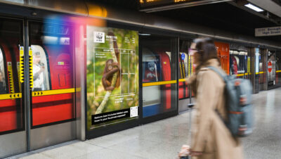 WWF UK's Nature's Invoice campaign on a advertising screen at Canary Wharf station on the Elizabeth Line.