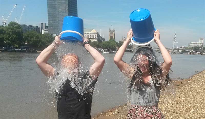 Marcus Missen and Hannah Wilkinson of WaterAid take the cold water drench